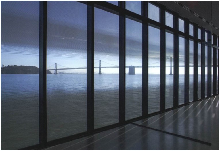 View of bay bridge through glass wall from inside